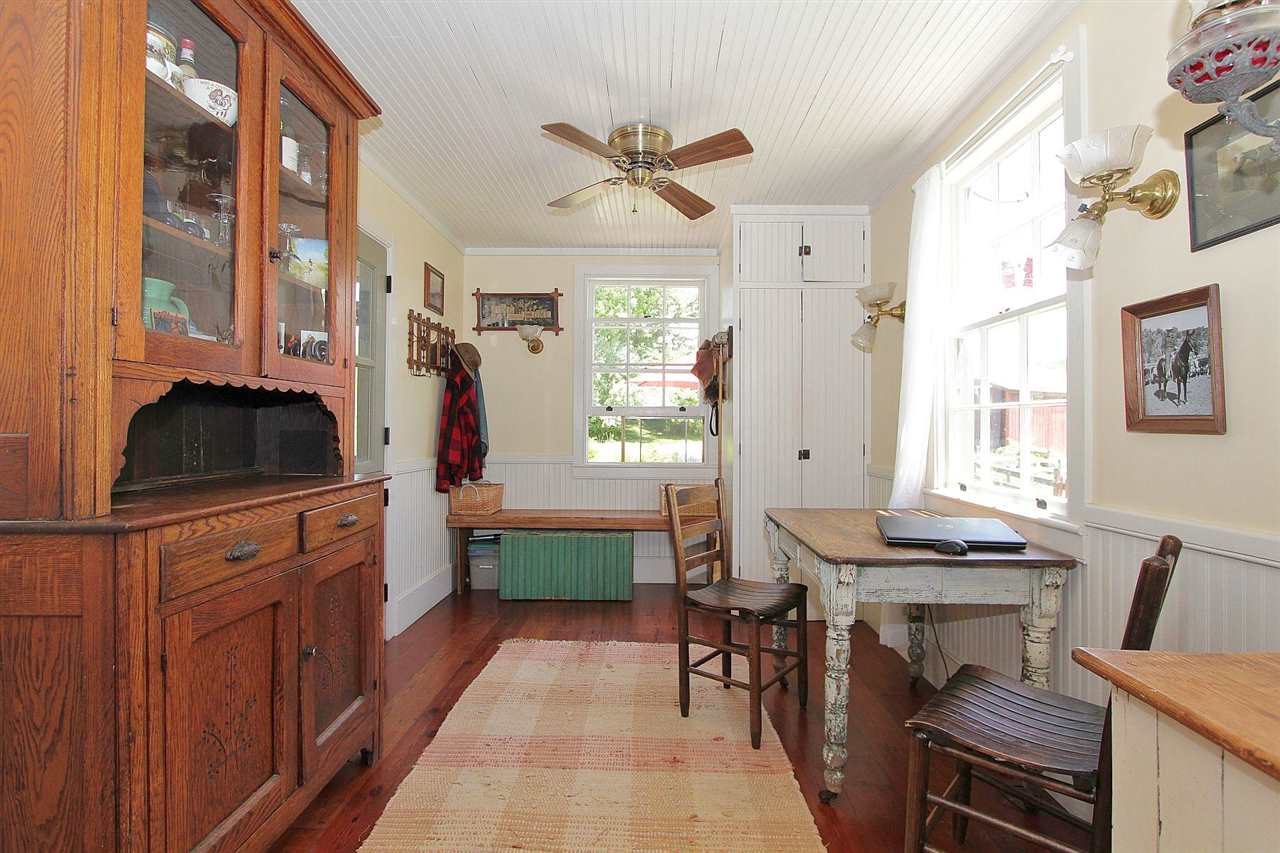 1108 Newport Road Raphine, VA 24472 - Photo 36 of 50 a kitchen with a table chairs stove and cabinets