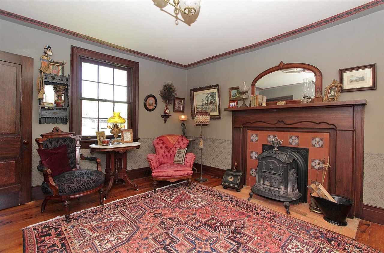 1108 Newport Road Raphine, VA 24472 - Photo 45 of 50 a living room with furniture a window and fireplace