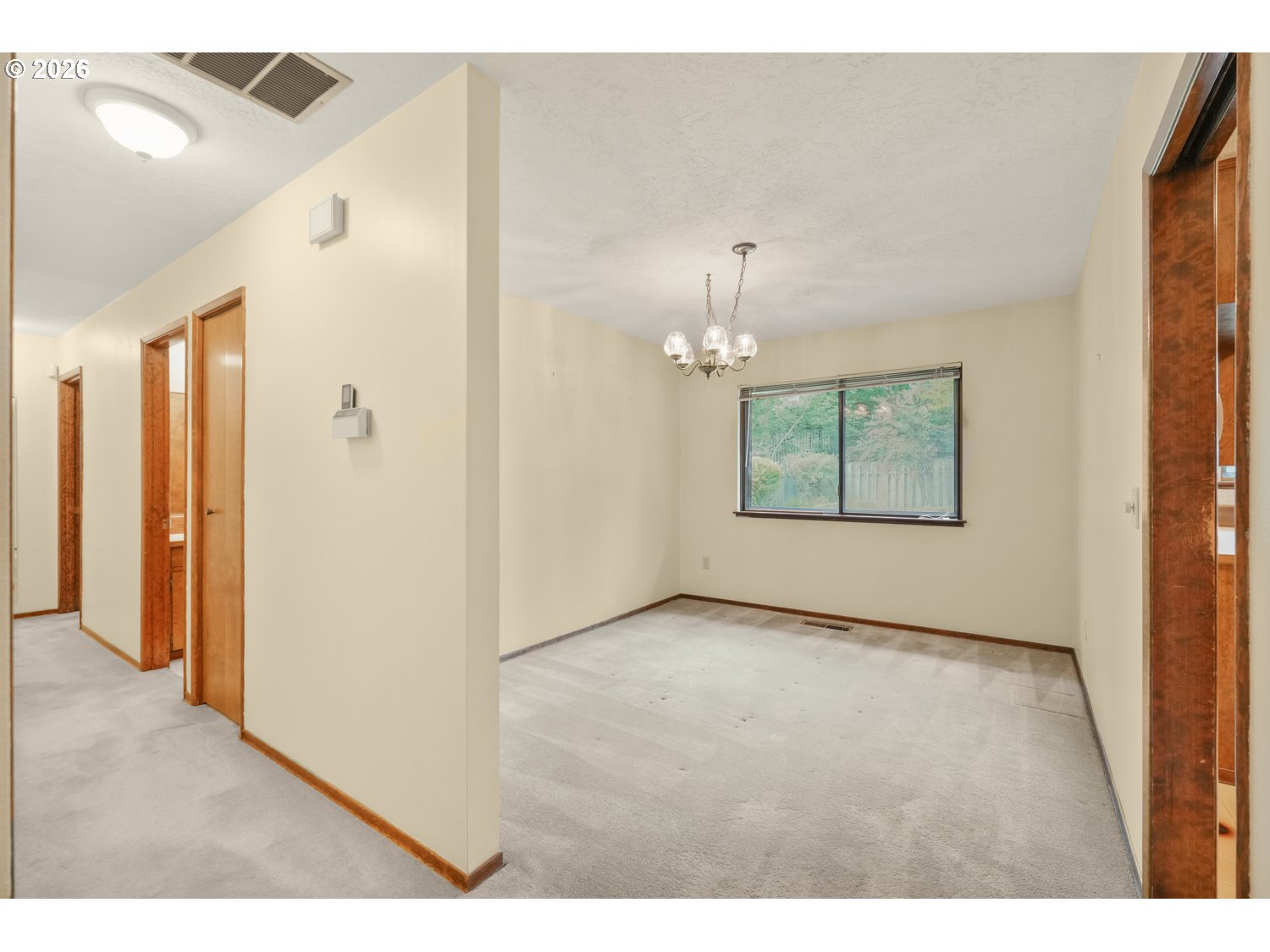 14155 Southwest 27th Street Beaverton, OR 97008 - Photo 8 of 27 a view of an empty room with a window