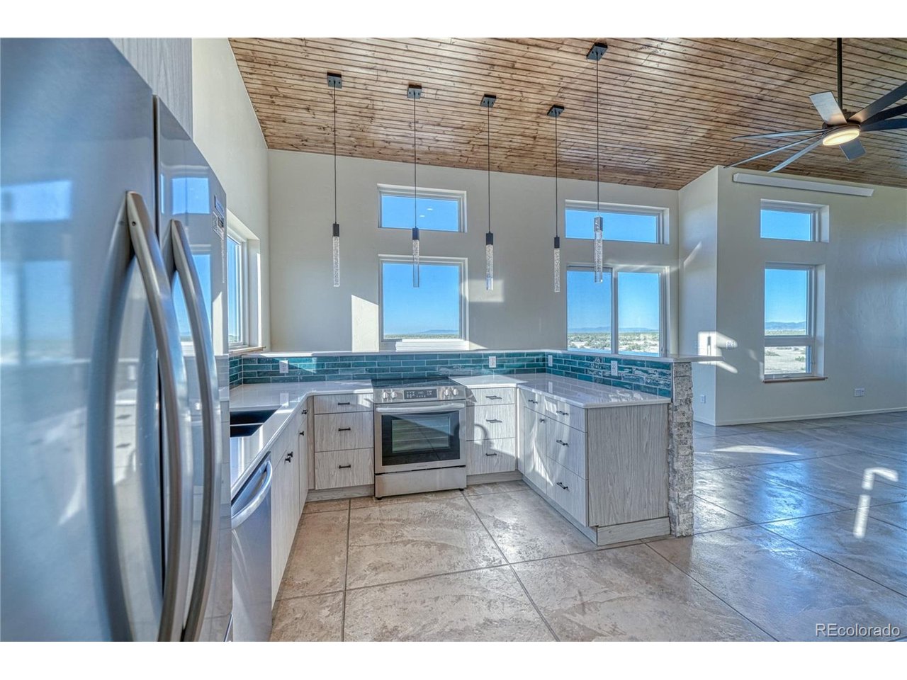 57884 Co Road Moffat, CO 81143 - Photo 10 of 39 Kitchen with Wrap-Around Bar