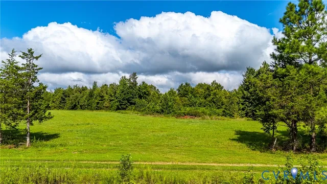 a view of lake with green space