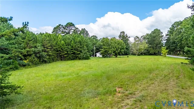 a view of a garden with a building in the background