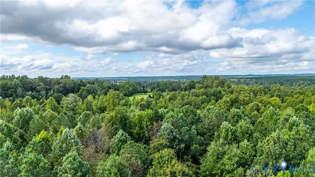 a view of a big yard with lots of green space