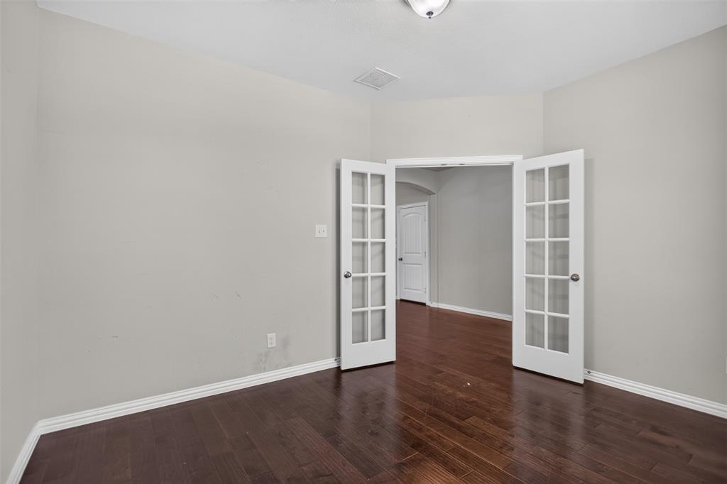 2066 Avondown Road Forney, TX 75126 - Photo 4 of 33 Room featuring wood-finish flooring, light gray wall paint, and white baseboards