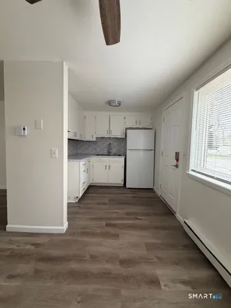 a view of a kitchen with a sink and a window