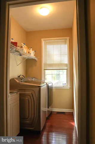 a view of a storage & utility room with washer and dryer