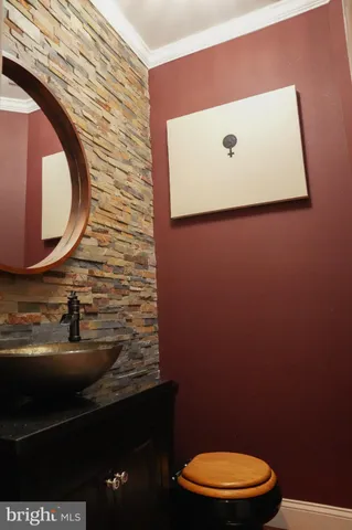 a bathroom with a toilet and a sink