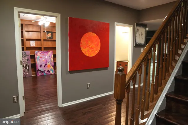 a view of entryway with wooden floor and stairs