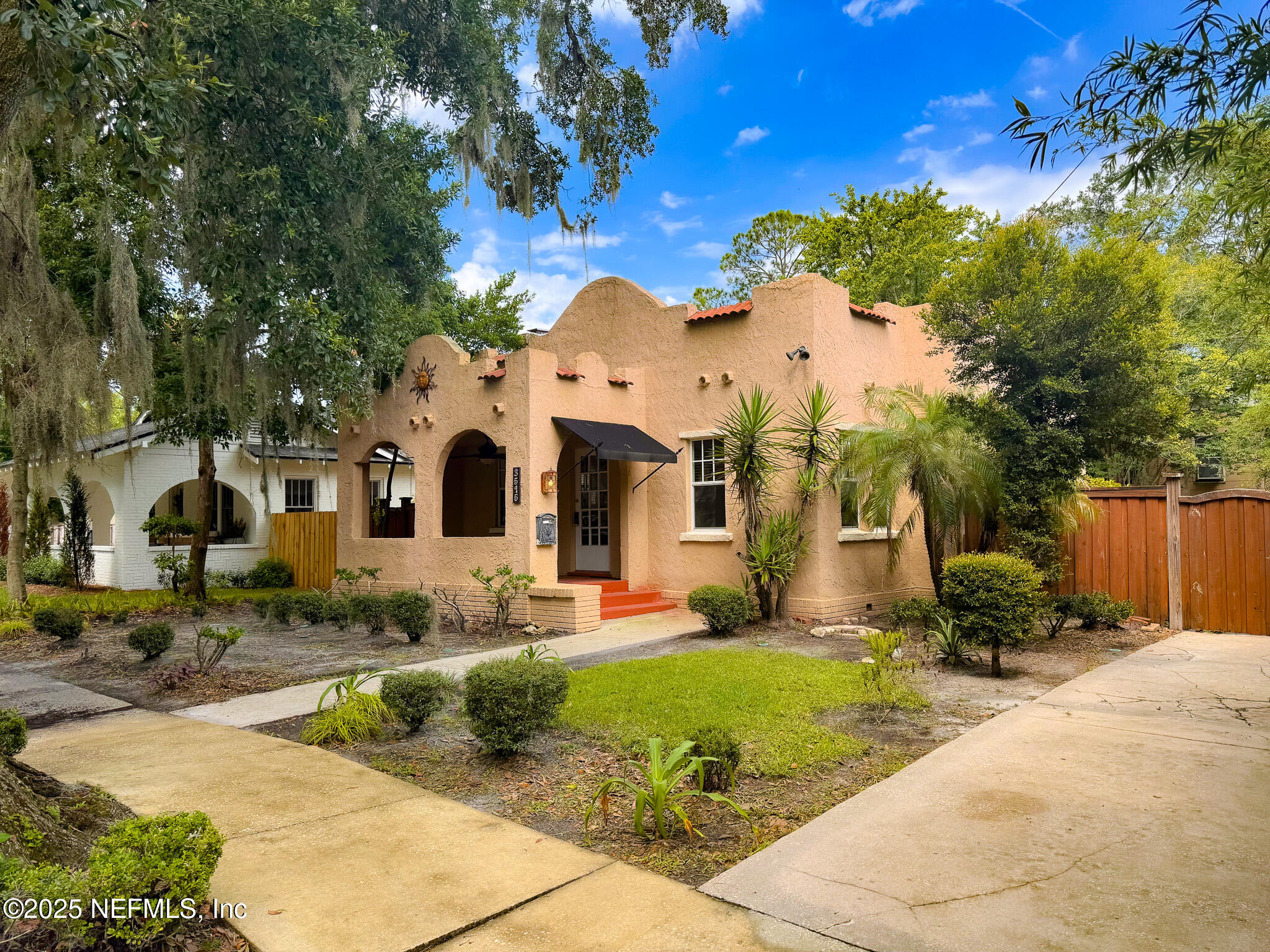 3515 Valencia Road Jacksonville, FL 32205 - Photo 1 of 24 a front view of a house with garden