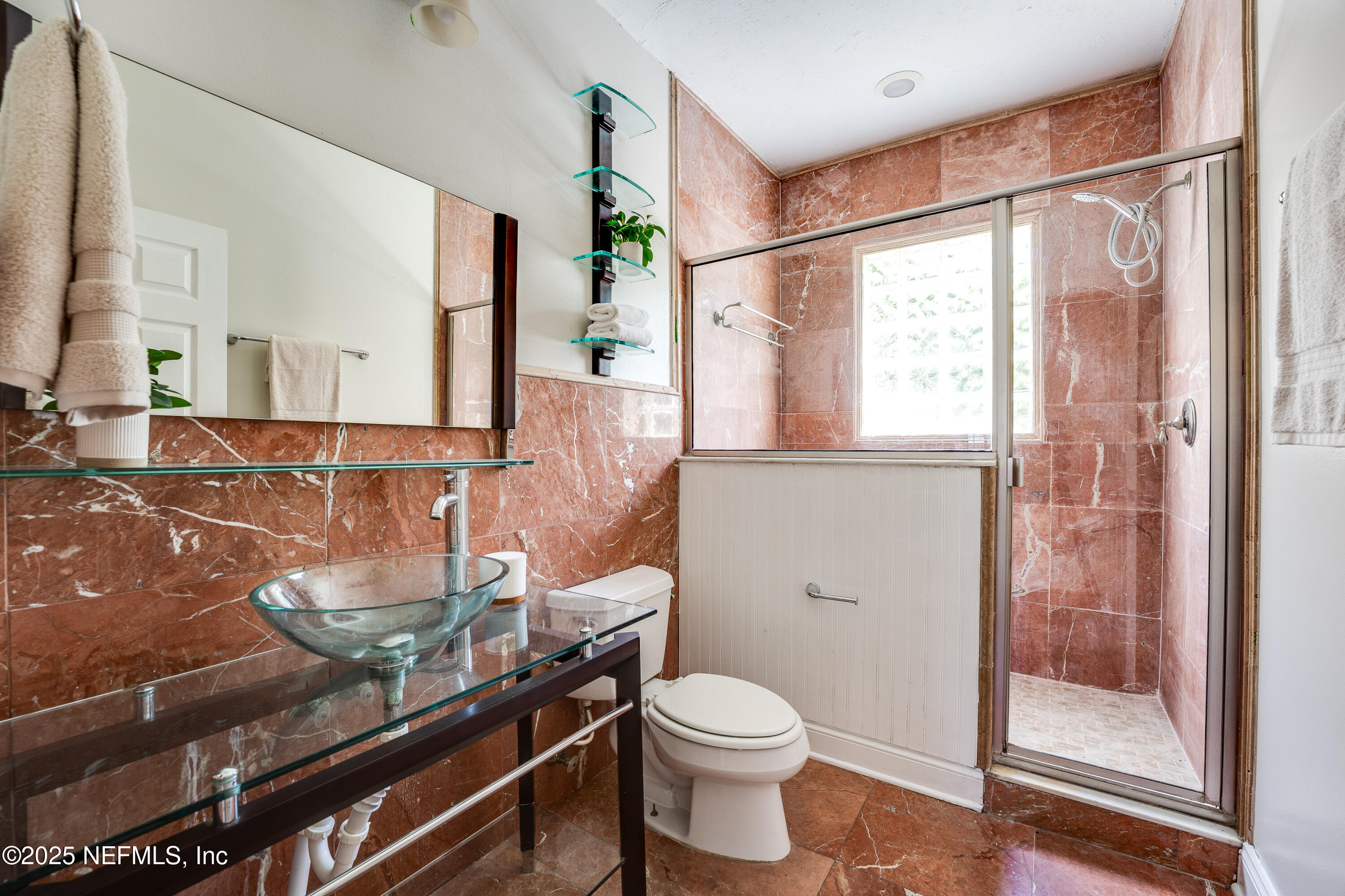 3515 Valencia Road Jacksonville, FL 32205 - Photo 11 of 24 a bathroom with a granite countertop sink a toilet and shower