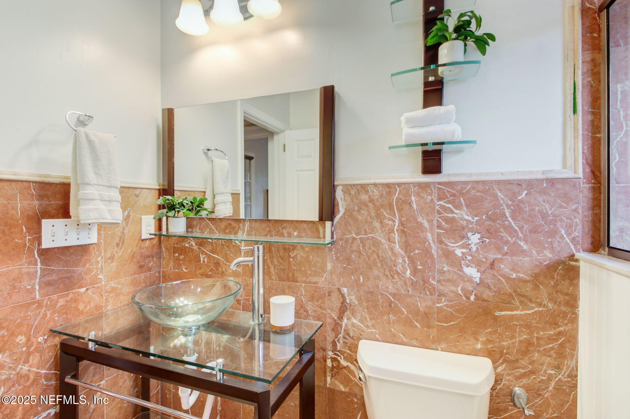 3515 Valencia Road Jacksonville, FL 32205 - Photo 12 of 24 a dining room with wooden floor and chandelier