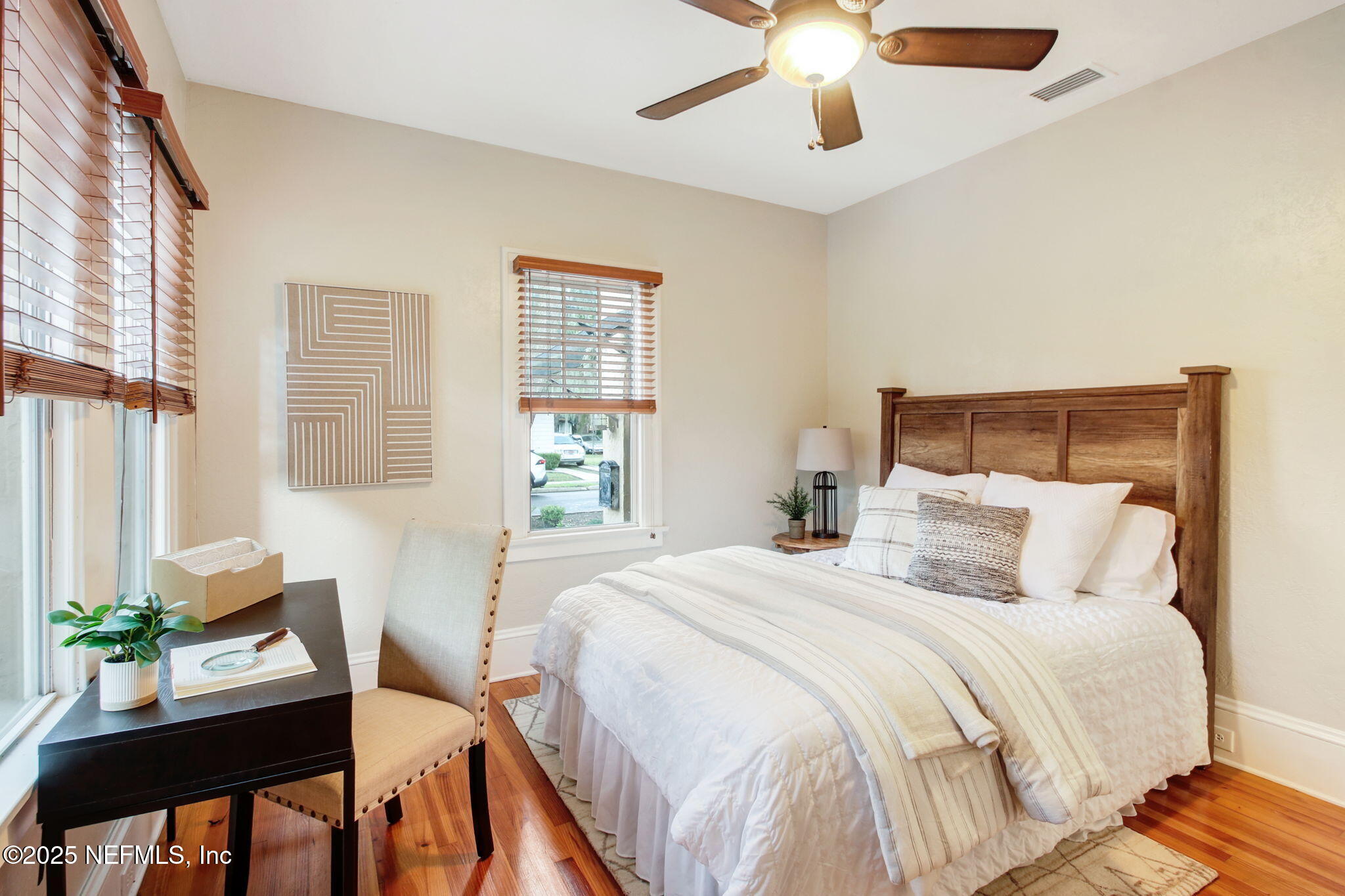 3515 Valencia Road Jacksonville, FL 32205 - Photo 14 of 24 a bedroom with a bed and a chandelier