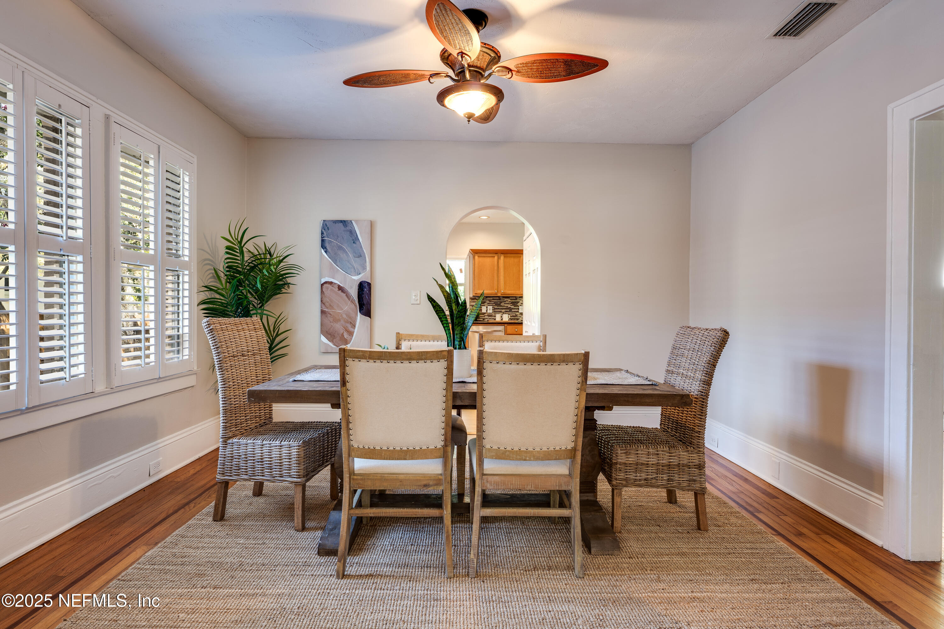 3515 Valencia Road Jacksonville, FL 32205 - Photo 5 of 24 a view of a dining room with furniture window and wooden floor