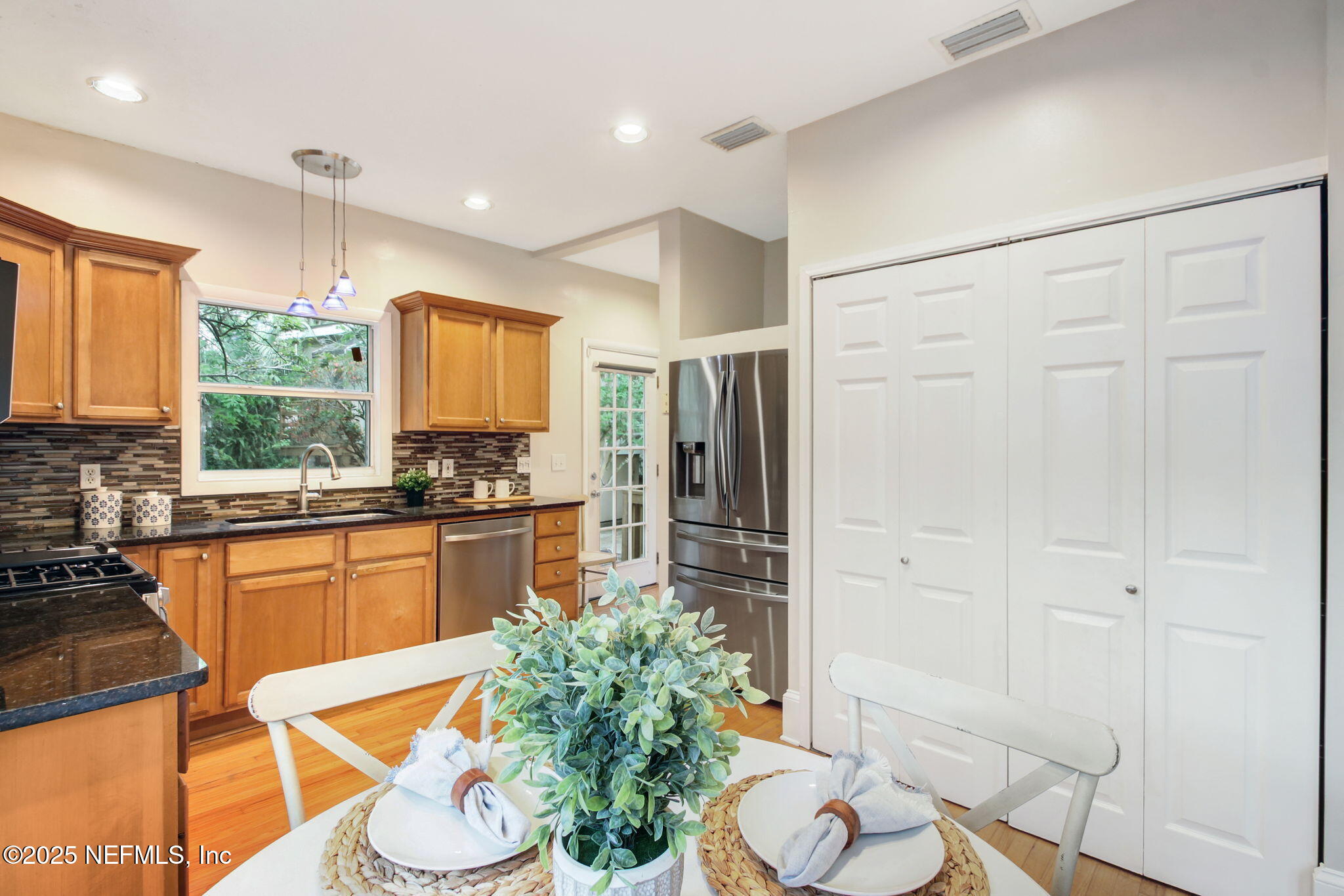 3515 Valencia Road Jacksonville, FL 32205 - Photo 8 of 24 a kitchen with stainless steel appliances a refrigerator and a stove top oven