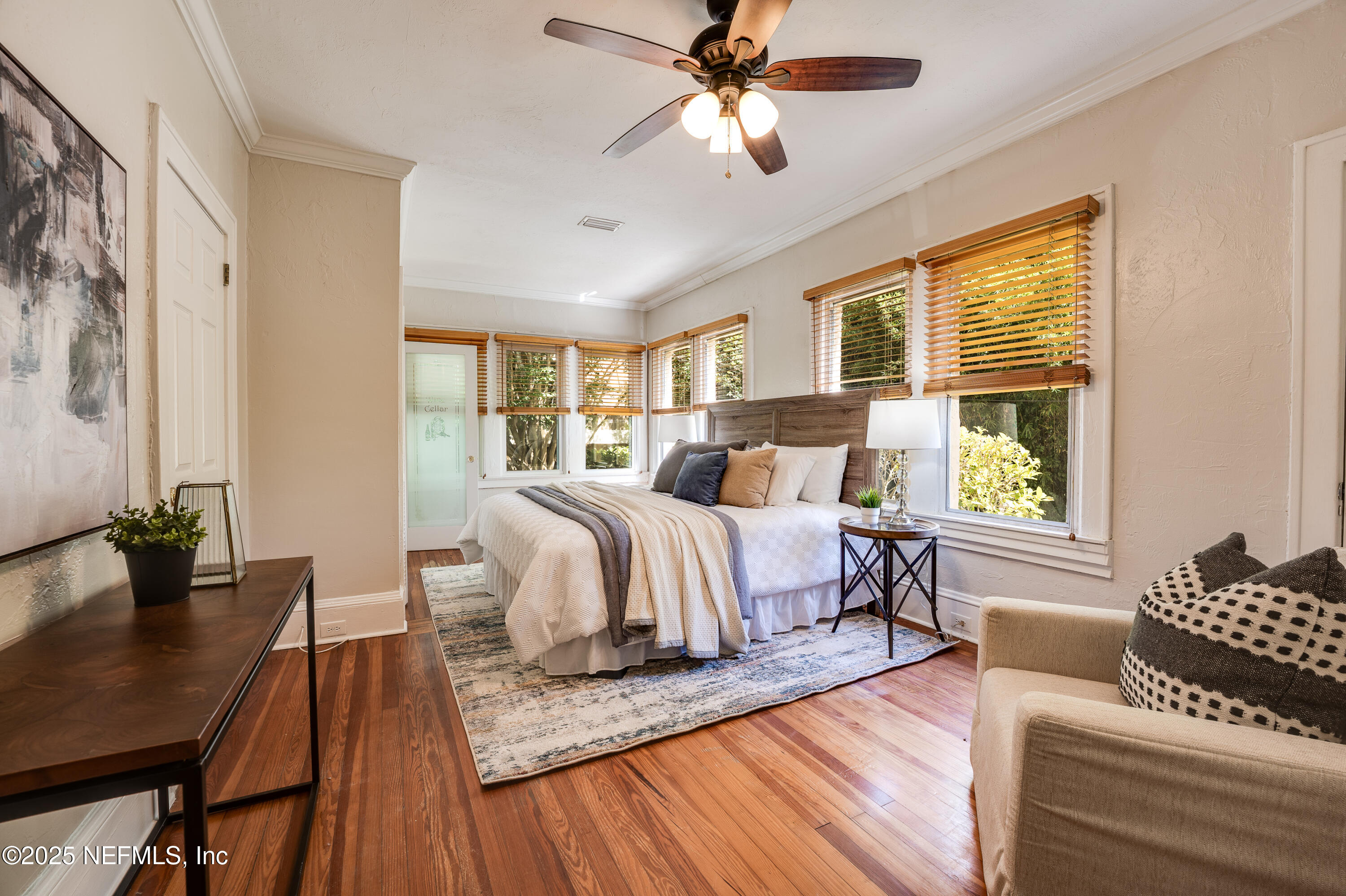 3515 Valencia Road Jacksonville, FL 32205 - Photo 10 of 24 a bedroom with a bed and wooden floor