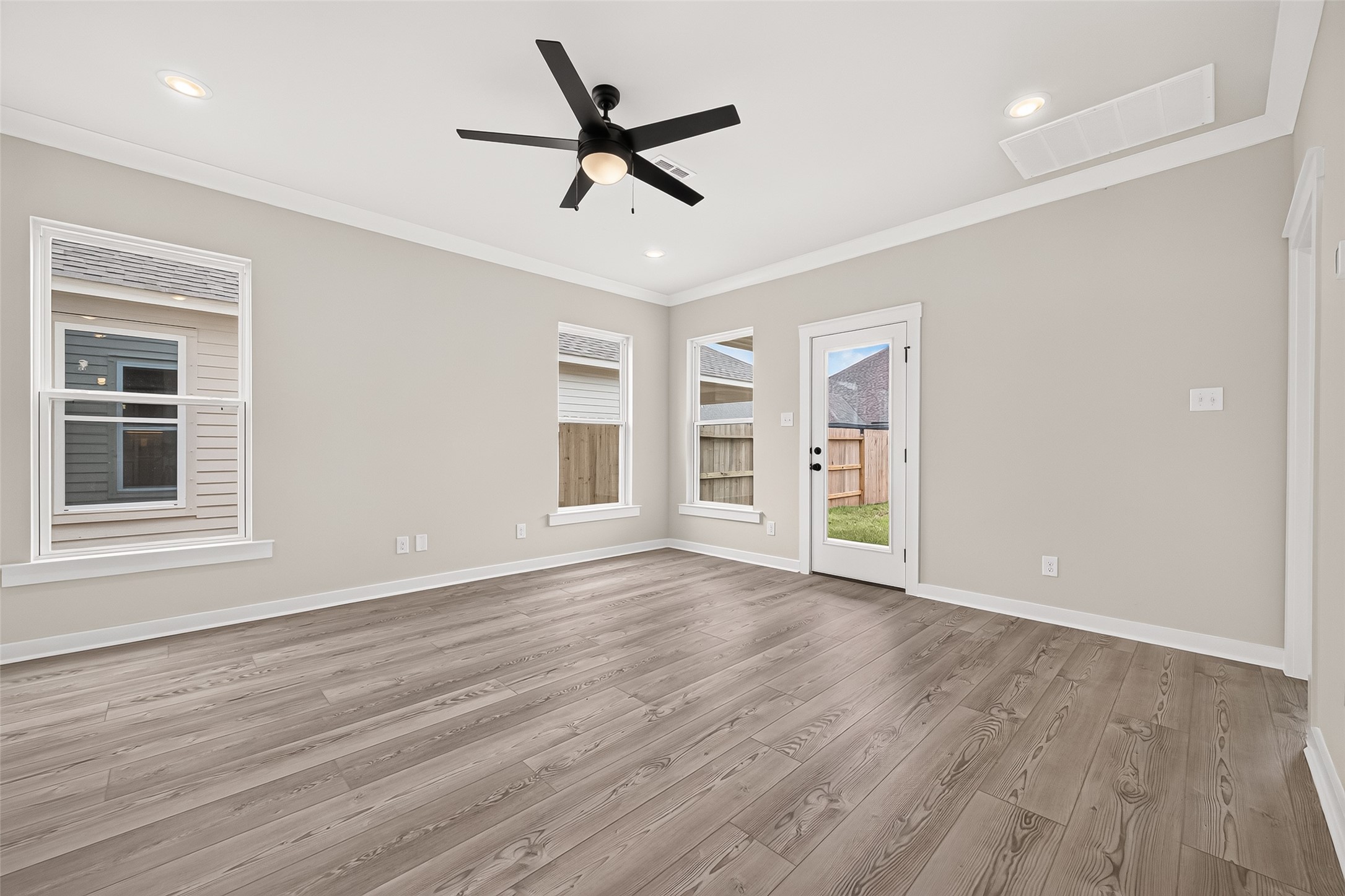 21122 Autumn Heights Rosharon, TX 77583 - Photo 10 of 42 a view of a livingroom with a hardwood floor and a ceiling fan