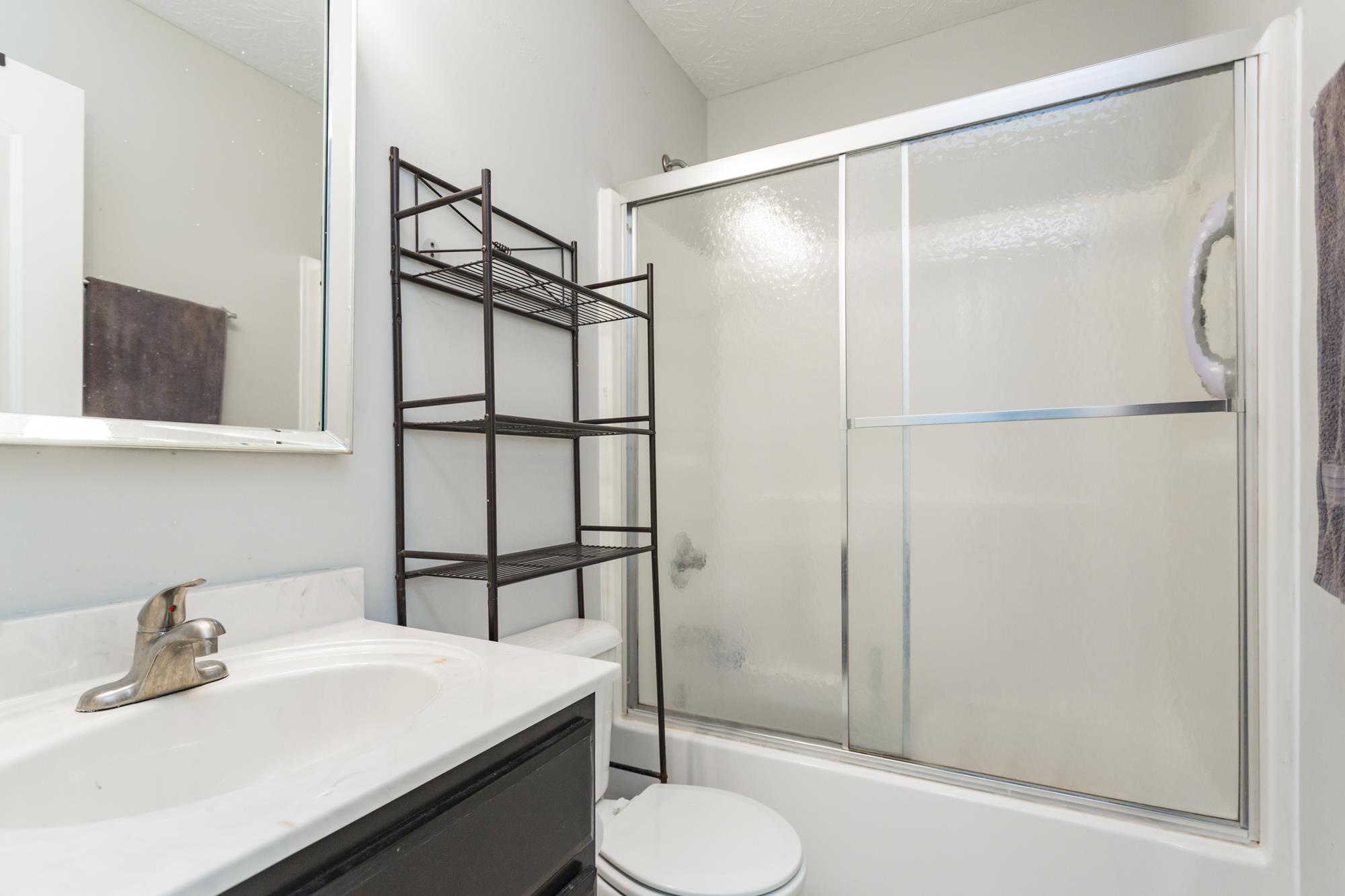 484 Fowler Ford Road Portland, TN 37148 - Photo 21 of 29 a bathroom with a sink toilet and shower