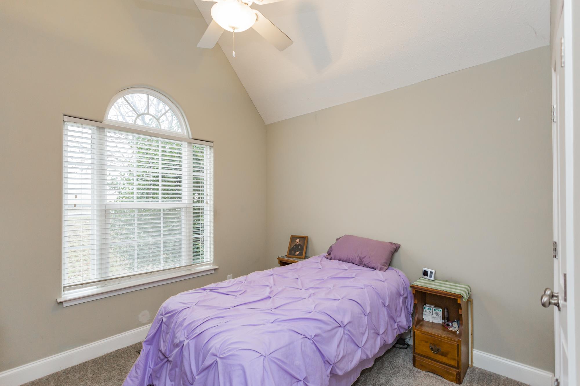 484 Fowler Ford Road Portland, TN 37148 - Photo 22 of 29 a bedroom with a bed and a window