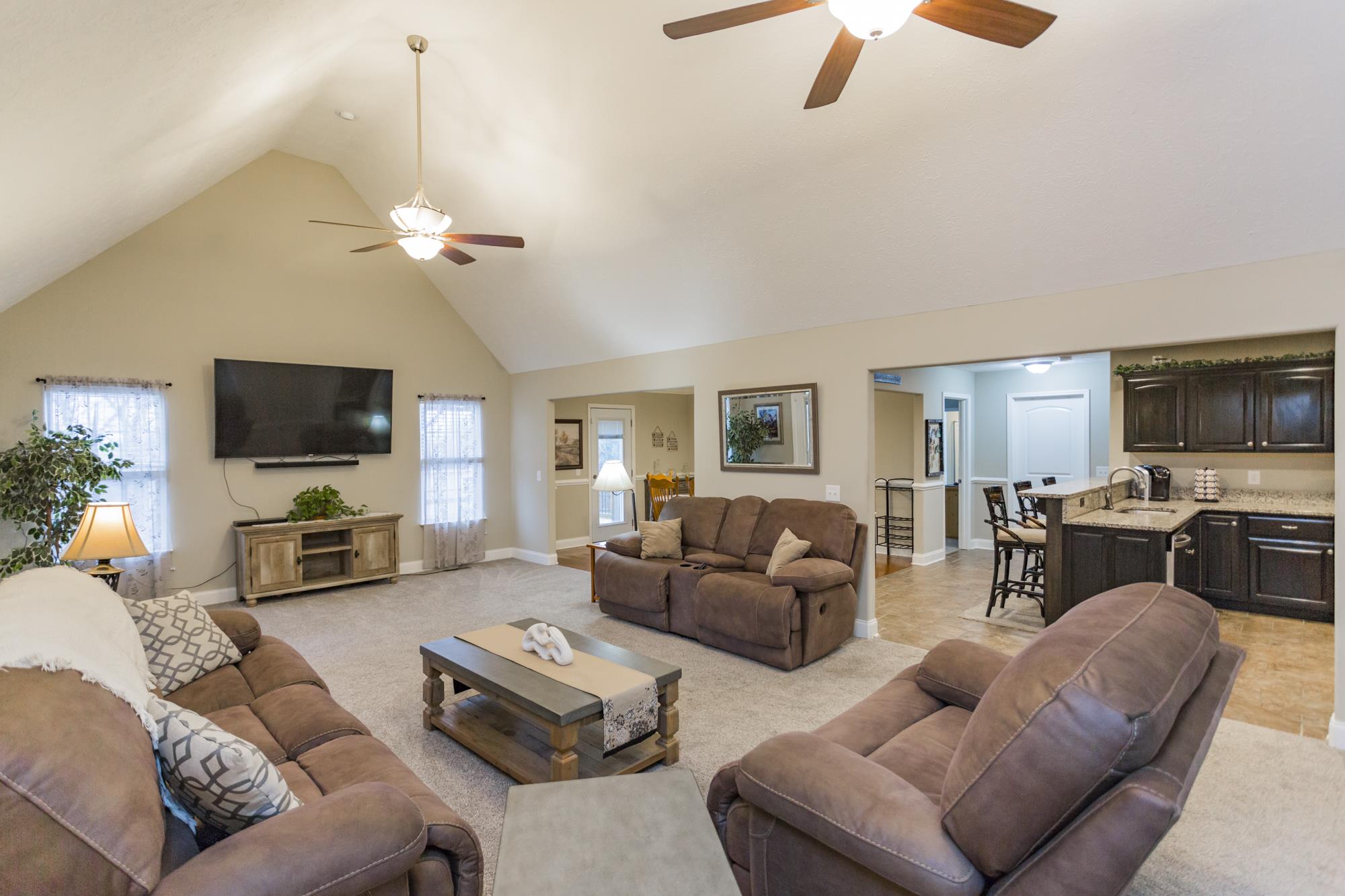 484 Fowler Ford Road Portland, TN 37148 - Photo 8 of 29 a living room with furniture a flat screen tv and a fireplace