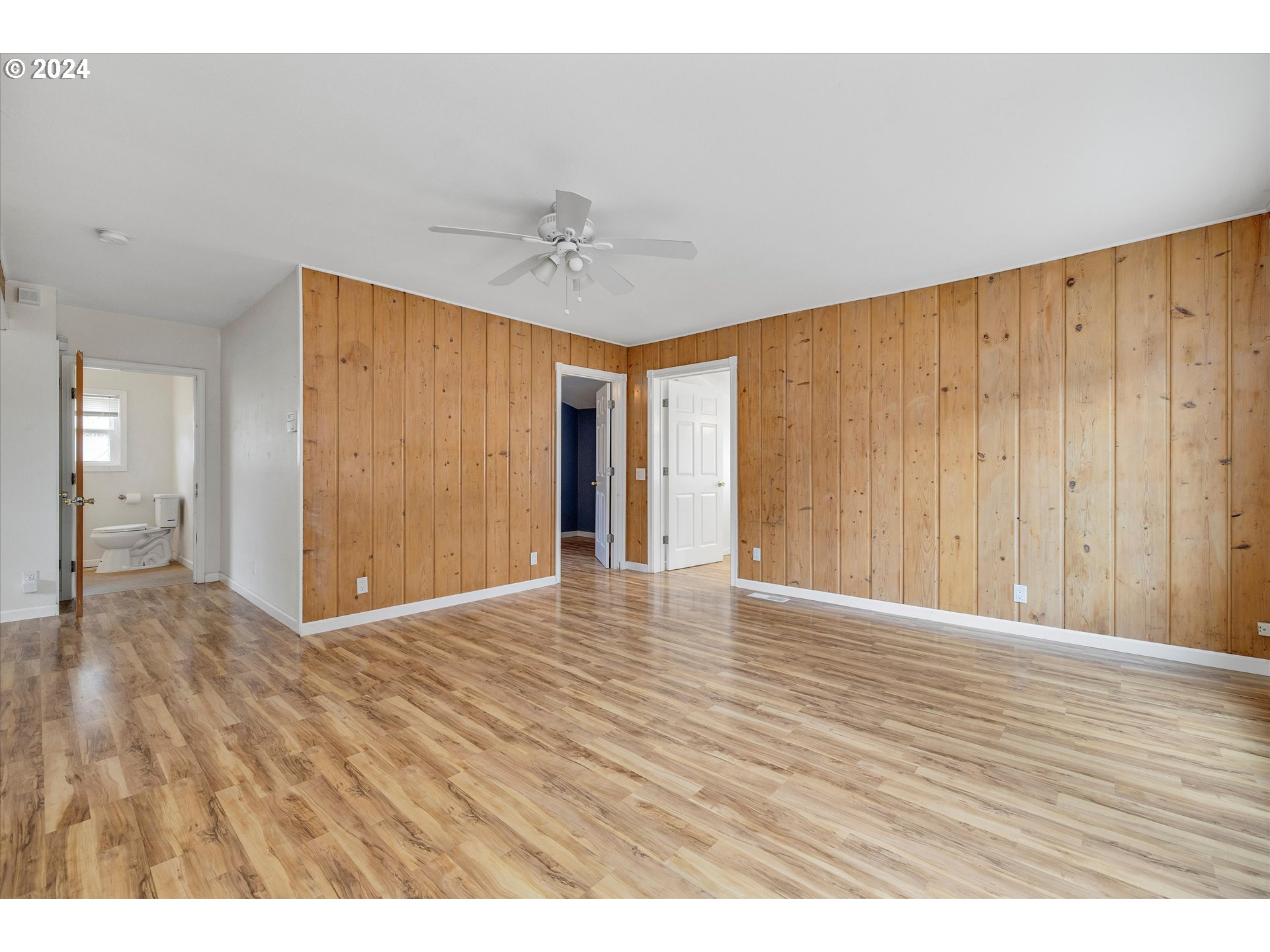 16265 Highway 224 Damascus, OR 97089 - Photo 11 of 40 a view of an empty room with wooden floor