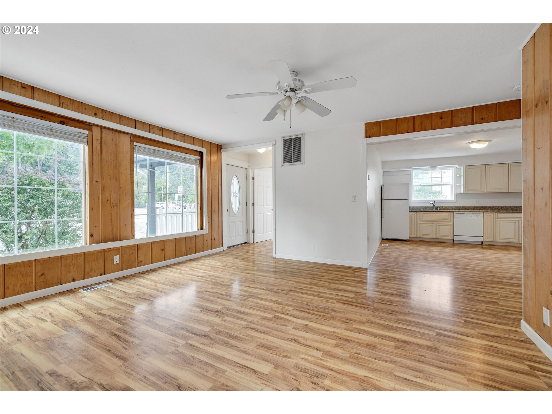 16265 Highway 224 Damascus, OR 97089 - Photo 13 of 40 a view of an empty room with window and wooden floor