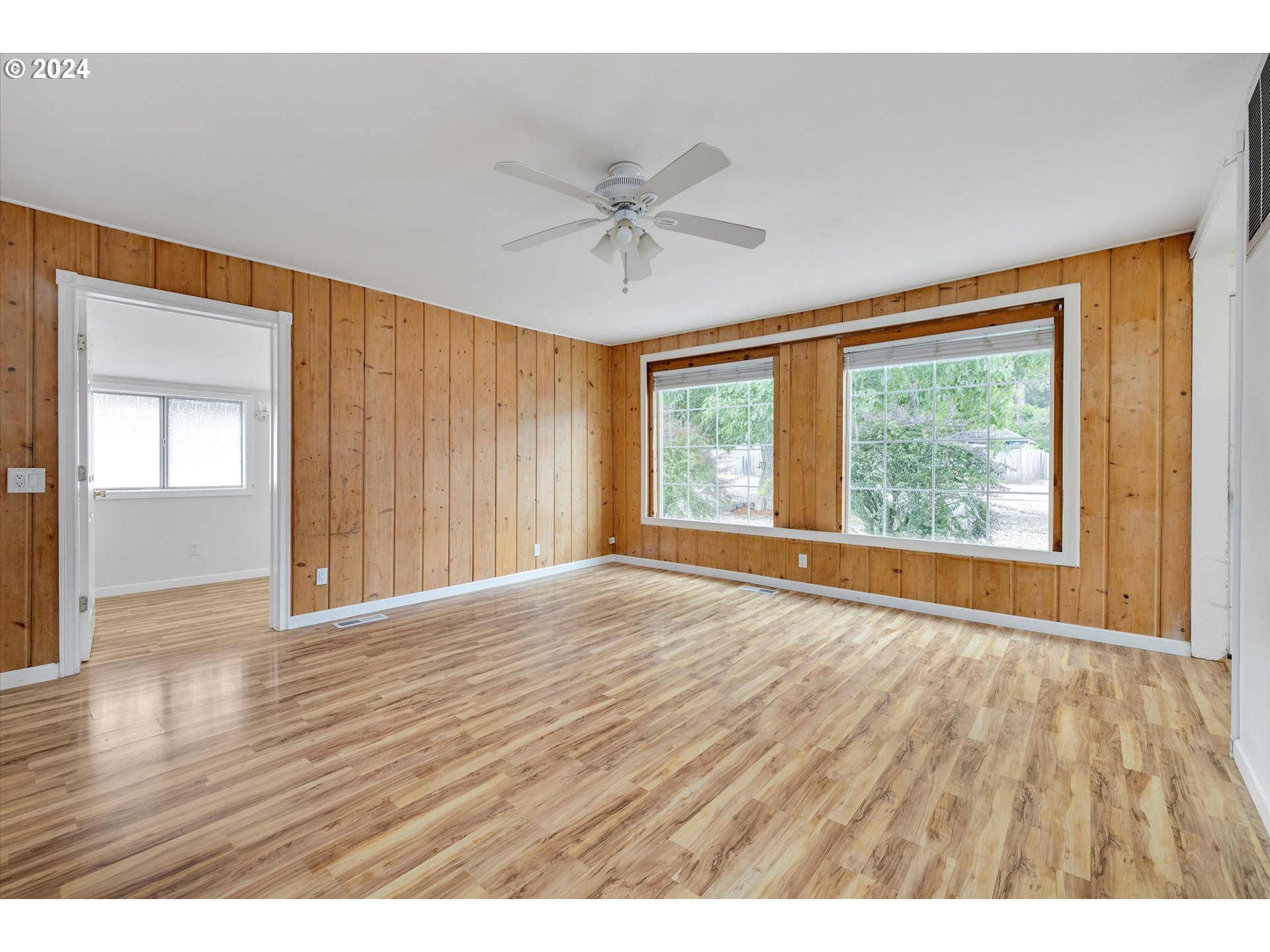 16265 Highway 224 Damascus, OR 97089 - Photo 14 of 40 wooden floor in an empty room with a window