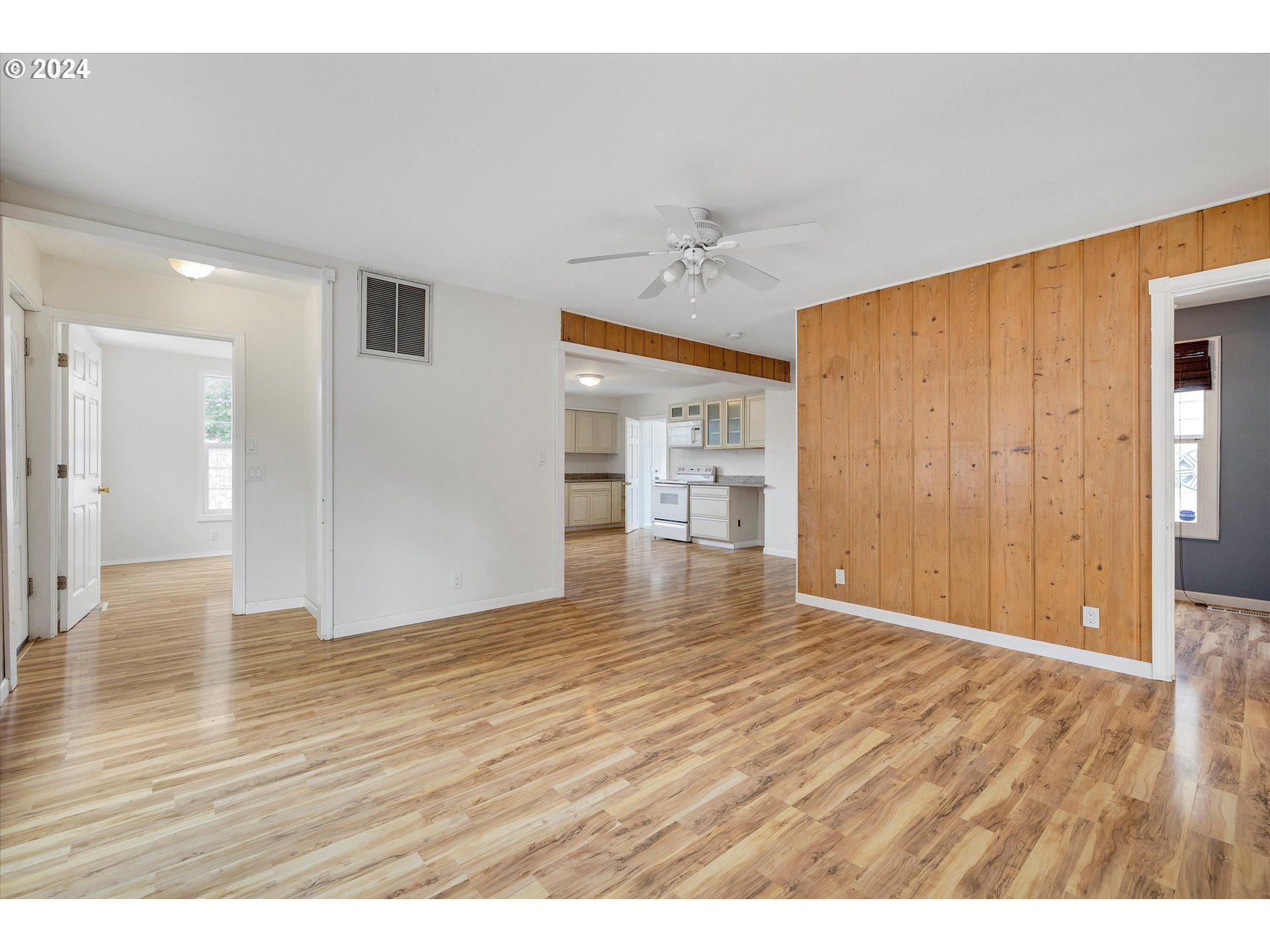 16265 Highway 224 Damascus, OR 97089 - Photo 16 of 40 a view of an empty room with wooden floor