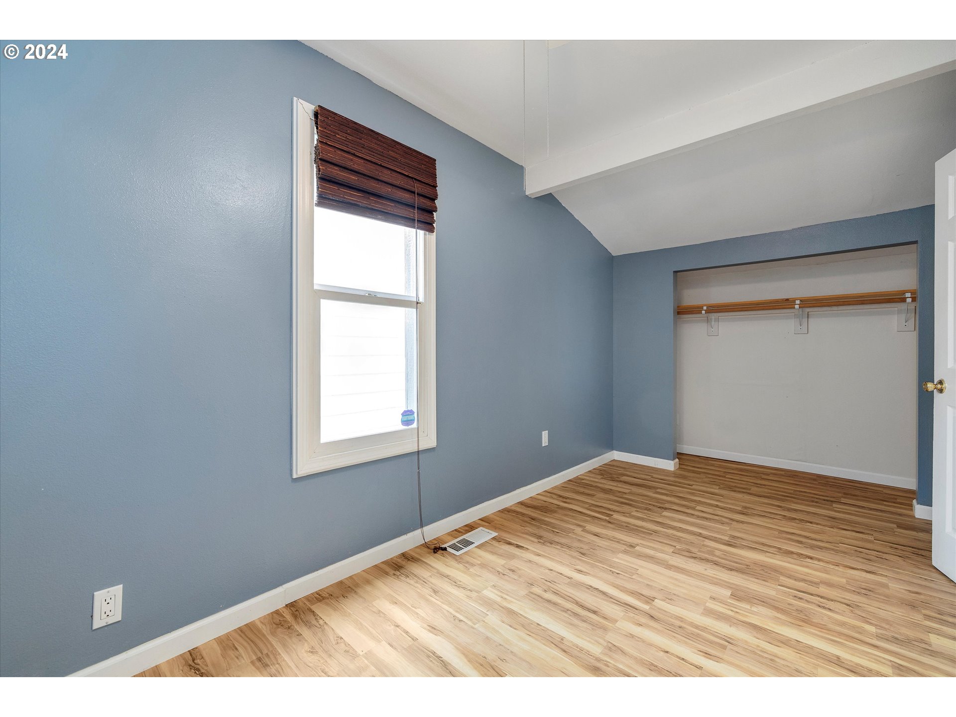 16265 Highway 224 Damascus, OR 97089 - Photo 19 of 40 a view of an empty room with wooden floor and a window