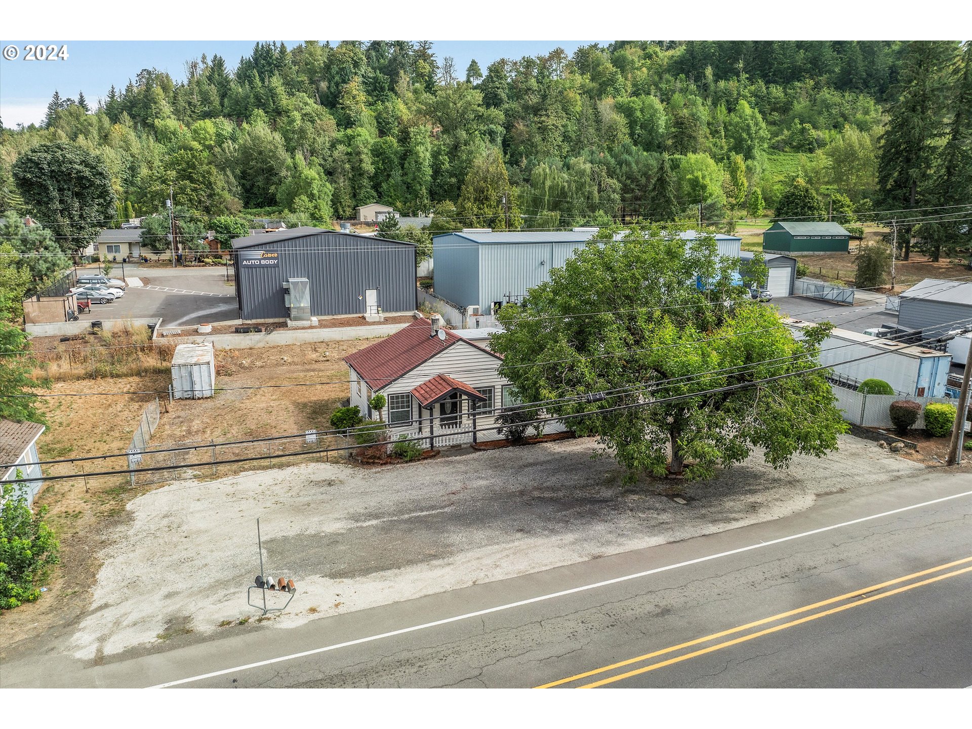 16265 Highway 224 Damascus, OR 97089 - Photo 2 of 40 an aerial view of a house with a yard and greenery