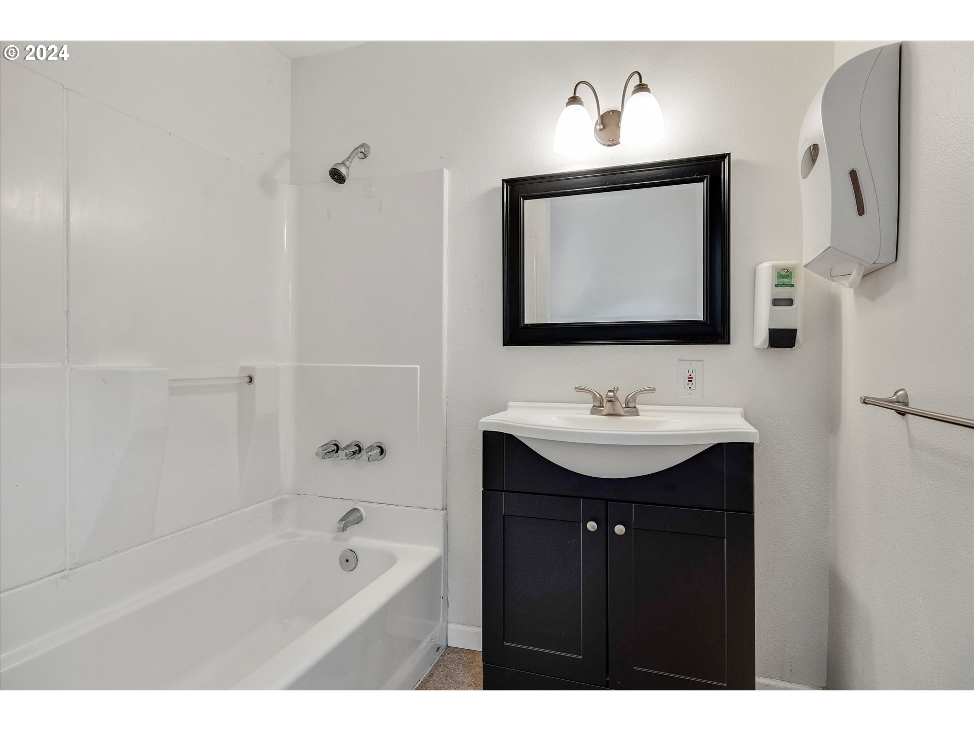 16265 Highway 224 Damascus, OR 97089 - Photo 22 of 40 a bathroom with a sink double vanity granite tub shower and a mirror