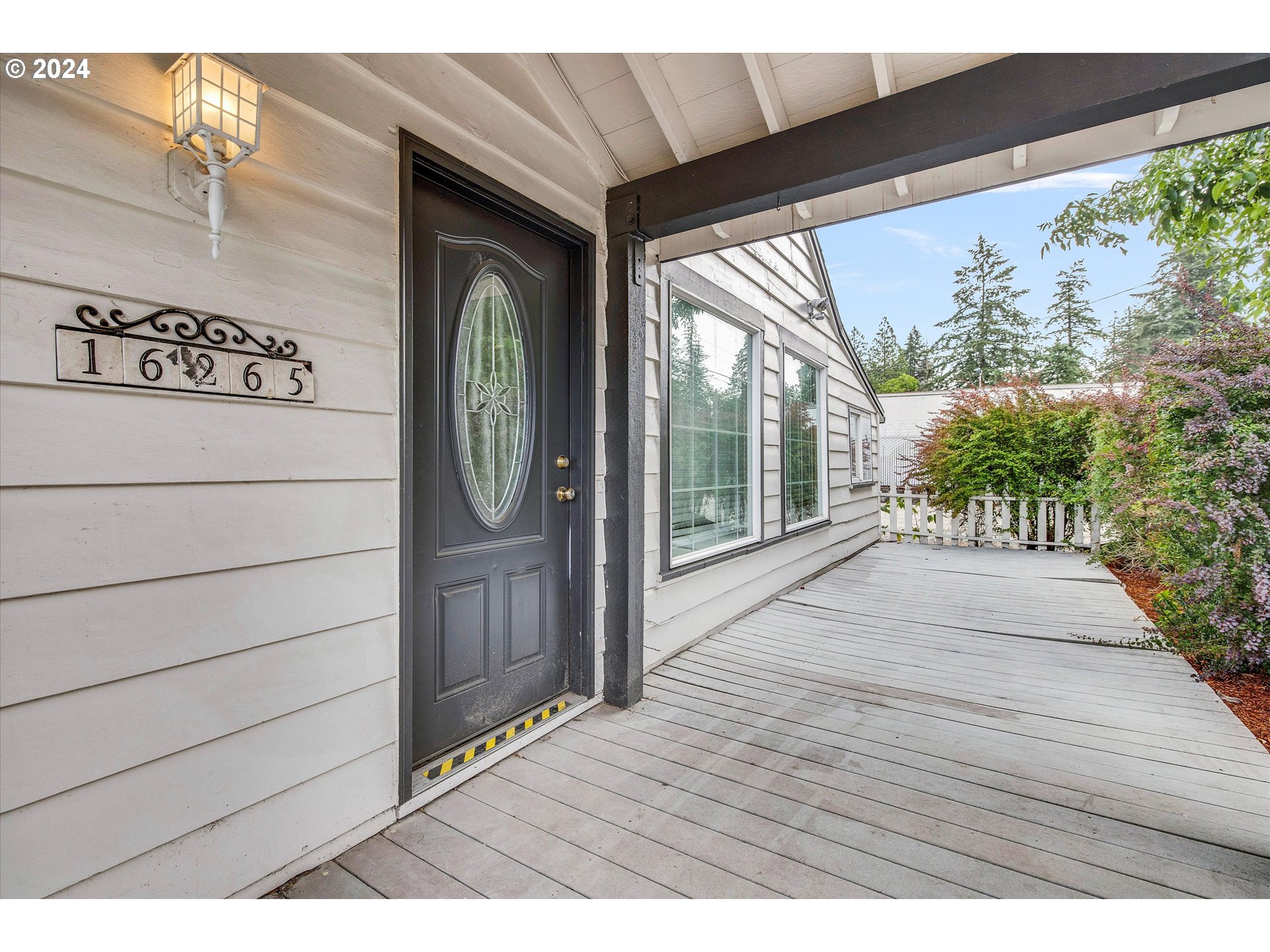 16265 Highway 224 Damascus, OR 97089 - Photo 6 of 40 a view of a wooden door with a large tree