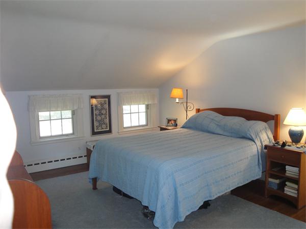 524 Concord Road Sudbury, MA 01776 - Photo 8 of 20 a bedroom with a bed and window