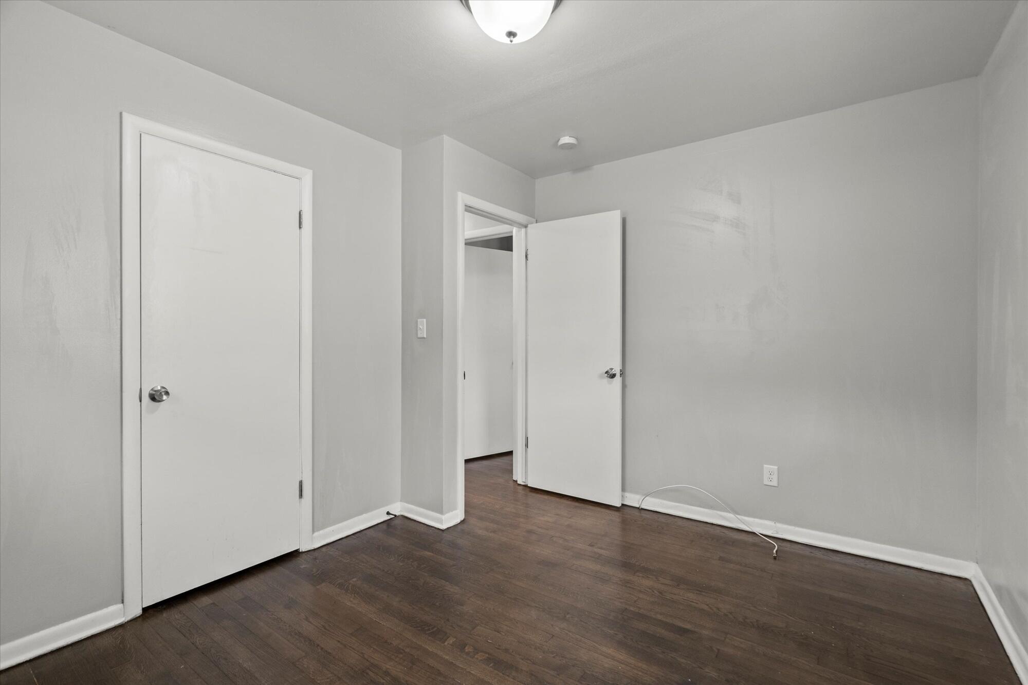 6715 East 3rd Avenue Gary, IN 46403 - Photo 24 of 25 a view of an empty room with wooden floor