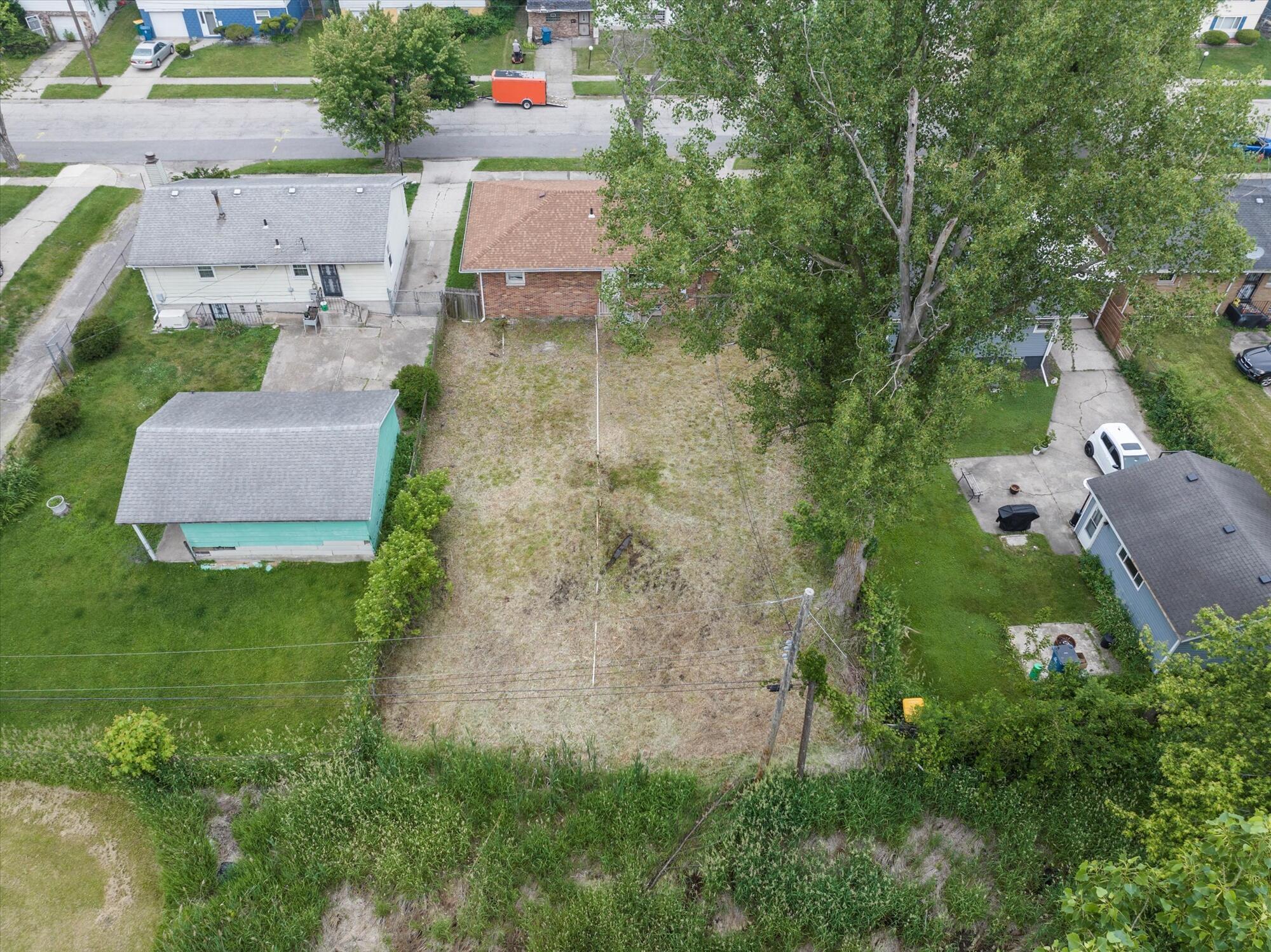 6715 East 3rd Avenue Gary, IN 46403 - Photo 4 of 25 an aerial view of residential house with outdoor space and trees all around