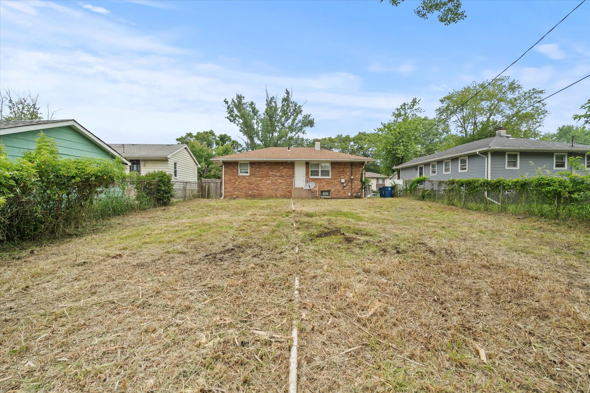 6715 East 3rd Avenue Gary, IN 46403 - Photo 10 of 25 a front view of house with yard and green space