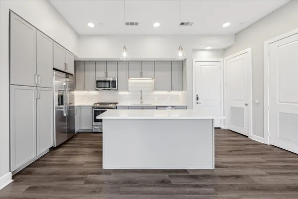 a view of kitchen with wooden floor