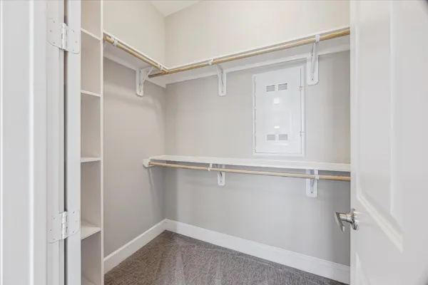 a view of an empty walk in closet