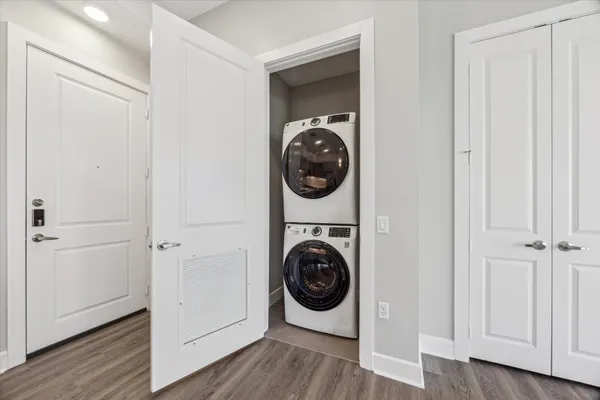 a view of a hallway with washer and dryer