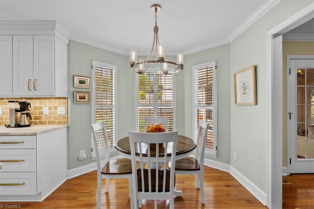 3303 Bardwell Road Greensboro, NC 27410 - Photo 15 of 50 The sellers are leaving the breakfast table and chairs.