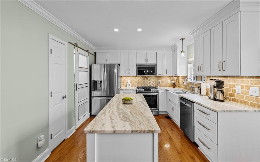 3303 Bardwell Road Greensboro, NC 27410 - Photo 17 of 50 This entertainer's dream kitchen features a large island. . .