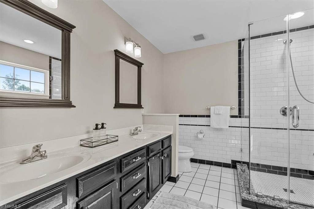 3303 Bardwell Road Greensboro, NC 27410 - Photo 30 of 50 Beautifully remodeled primary bath with dual vanity