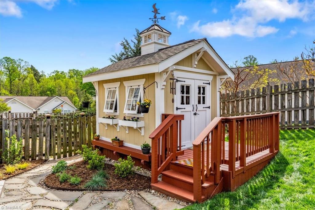 3303 Bardwell Road Greensboro, NC 27410 - Photo 46 of 50 The gardening shed, built by Paul, matches the home!