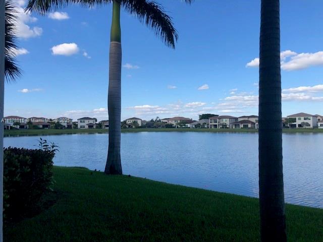 1415 Southwest 113th Avenue, Unit 1415 Pembroke Pines, FL 33025 - Photo 14 of 44 a view of a lake from a yard