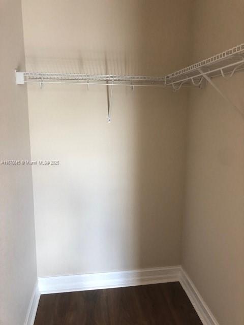 1415 Southwest 113th Avenue, Unit 1415 Pembroke Pines, FL 33025 - Photo 23 of 44 a view of a room with racks on the wall