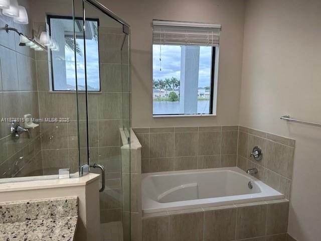 1415 Southwest 113th Avenue, Unit 1415 Pembroke Pines, FL 33025 - Photo 29 of 44 a bath tub sitting next to a window