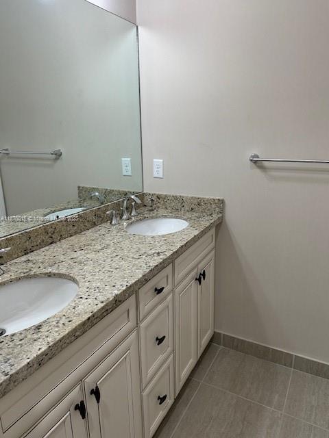 1415 Southwest 113th Avenue, Unit 1415 Pembroke Pines, FL 33025 - Photo 32 of 44 a bathroom with a granite countertop sink and a granite