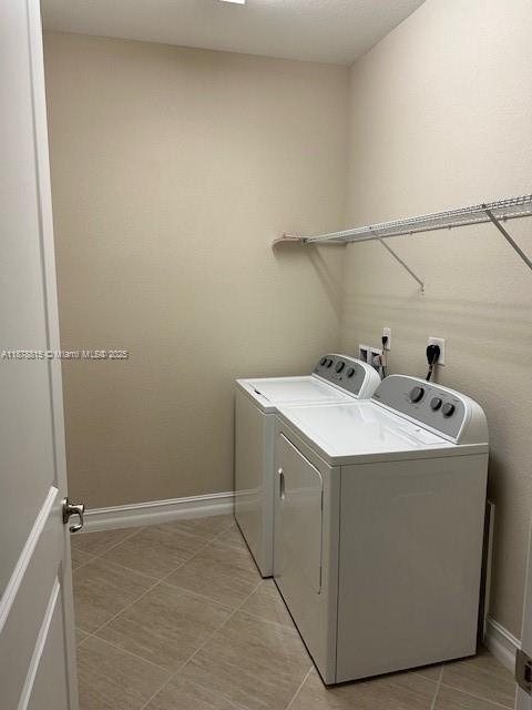 1415 Southwest 113th Avenue, Unit 1415 Pembroke Pines, FL 33025 - Photo 39 of 44 a utility room with dryer and washer