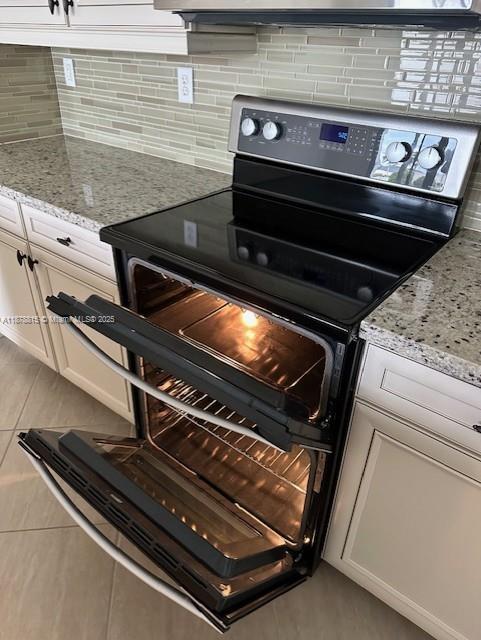 1415 Southwest 113th Avenue, Unit 1415 Pembroke Pines, FL 33025 - Photo 9 of 44 a close view of stove top oven