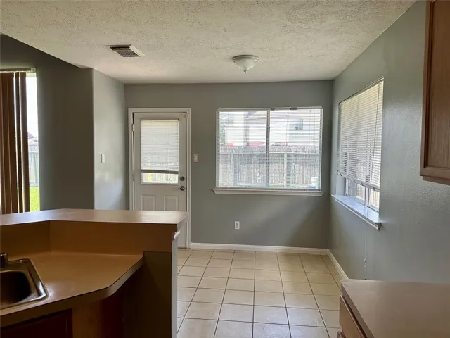 a view of kitchen with furniture and window