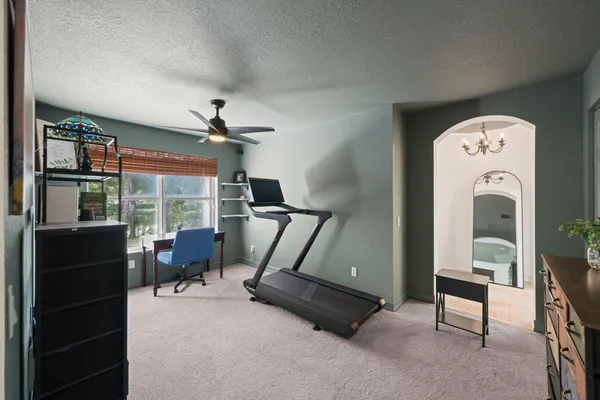 a bathroom with a bathtub and a window